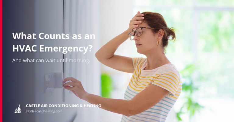 Houston homeowner looking overheated while checking a thermostat during an air conditioning failure