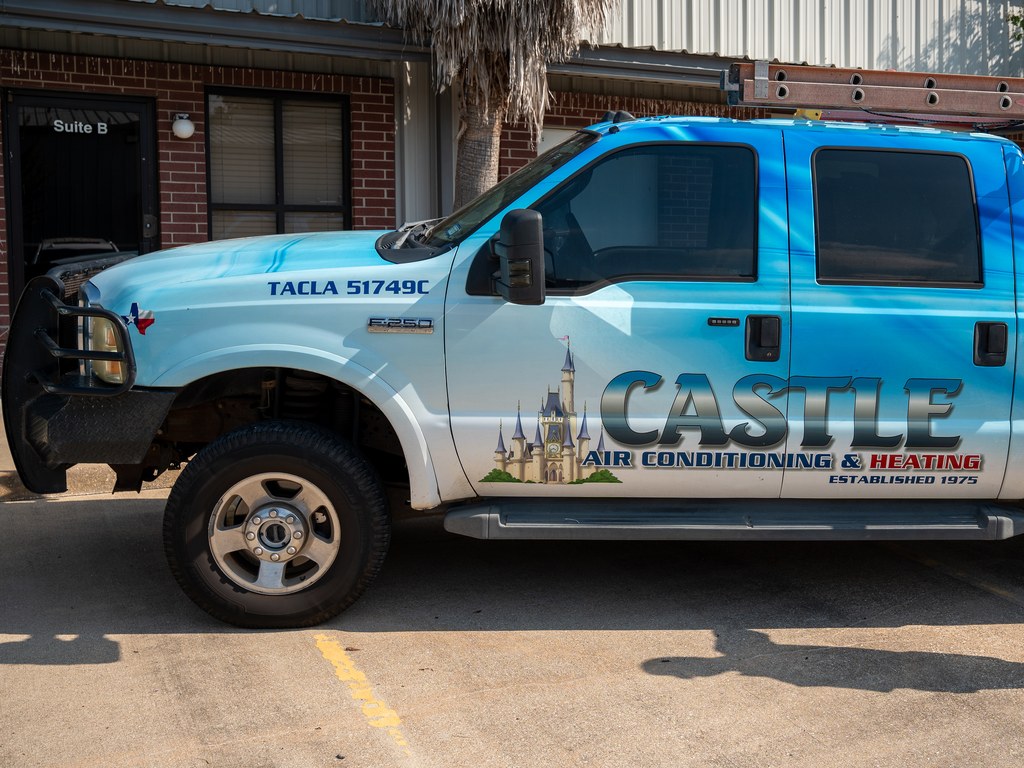 A Castle Air Conditioning and Heating service truck at the company shop in Fulshear, Texas