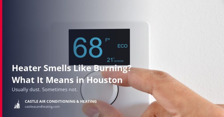 Hand turning the dial on a home thermostat set to 68 degrees Fahrenheit