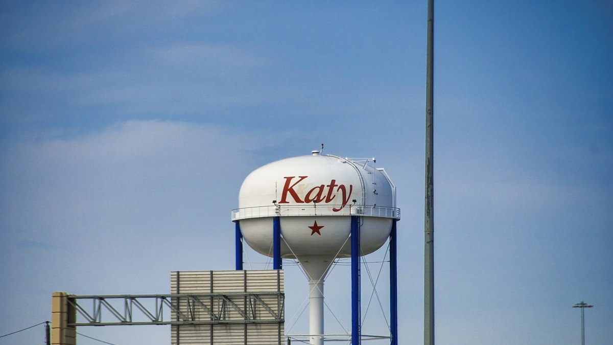 The Katy water tower against a blue sky in Katy, Texas